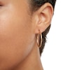 Thumbnail Image 2 of 10K Gold 27mm Diamond-Cut Tube Hoop Earrings